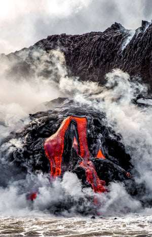 Molten lava meeting the sea in clouds of steam off Hawaii's Big Island