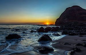 Lost and Found fine art print of a golden sunset over a volcanic Malibu shoreline with tide-pool rocks
