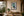 Ancient Deity resplendent quetzal fine art print framed on a tall wall in a warm Costa Rican cloud-forest-inspired living room