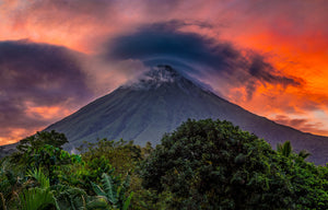 Crowned in Fire fine art print — Arenal Volcano crowned by a lenticular cloud beneath a fiery orange sunset sky in Costa Rica