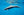 Marine Mirage fine art print of a dolphin gliding through clear blue open ocean water