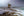 Caribbean Castaway fine art print — a lone tree on a sea stack amid misty long-exposure waves under a moody Caribbean sky