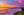 Pacific Afterglow fine art print of a vivid pink and orange sunset over the Pacific Ocean with a cliffside coastline