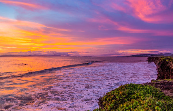 Pacific Afterglow fine art print of a vivid pink and orange sunset over the Pacific Ocean with a cliffside coastline