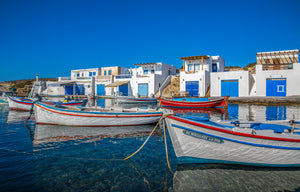 Whitewashed coastal architecture above the Aegean on Milos Island, Greece