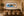 King's Landing panoramic Dubrovnik Croatia coastline fine art print framed above a long walnut credenza in an elegant Mediterranean-inspired luxury dining room