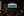 Launch The Torpedoes panoramic school of tuna fine art print framed and picture-lit on a dark paneled wall above a console in a moody luxury cocktail and cigar lounge