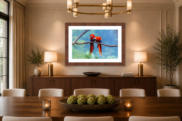 Love Birds scarlet macaw fine art print framed in walnut above a fluted sideboard in an elegant luxury dining room