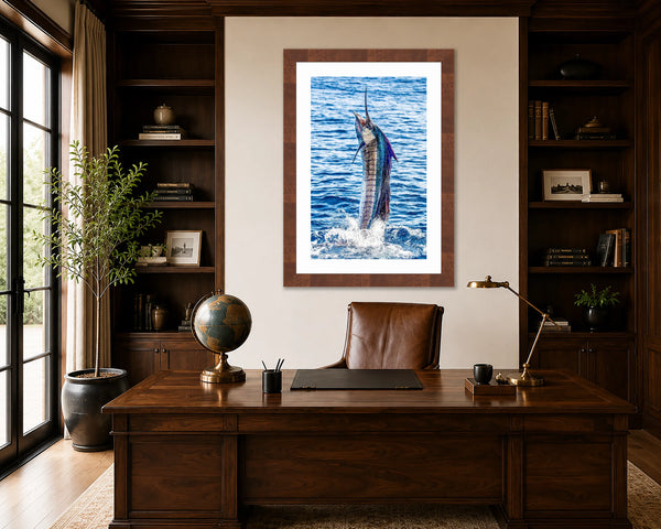 Pez Vela leaping sailfish fine art print framed in walnut on a wall behind a wood desk in a refined executive home office