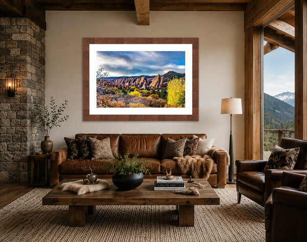 Roxborough Colorado red rock autumn fine art print framed in walnut above a leather sofa in a warm mountain-modern lodge living room