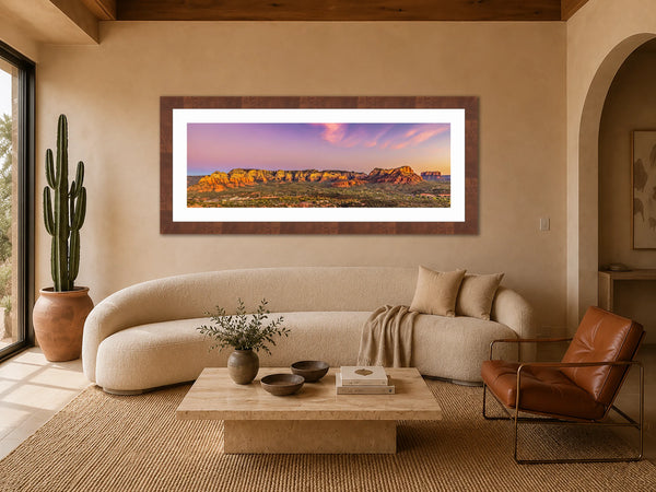 Soul Of Sedona red rock panorama framed above a curved bouclé sofa in an organic desert-modern living room
